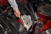 Photo of a hand using a Craftsman wrench, SKU CMMT87220, to tighten a bolt on a car engine.
