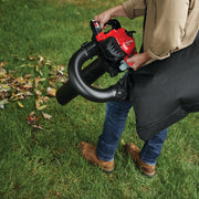 Photo of Craftsman leaf blower and vacuum CMXGAAMR7BVM on grass with attached collection bag.